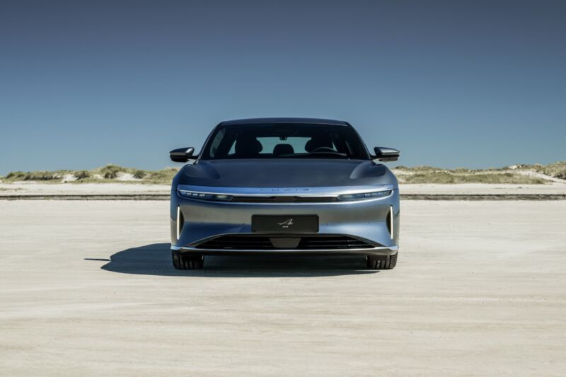 A blue metallic Lucid Air seen head-on